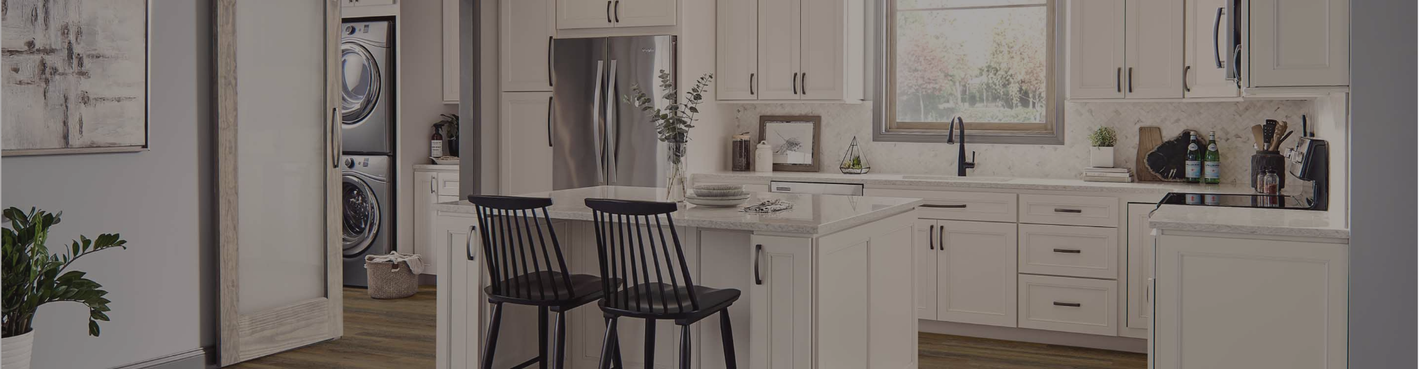wood-look flooring in a kitchen with white cabinetry and countertops