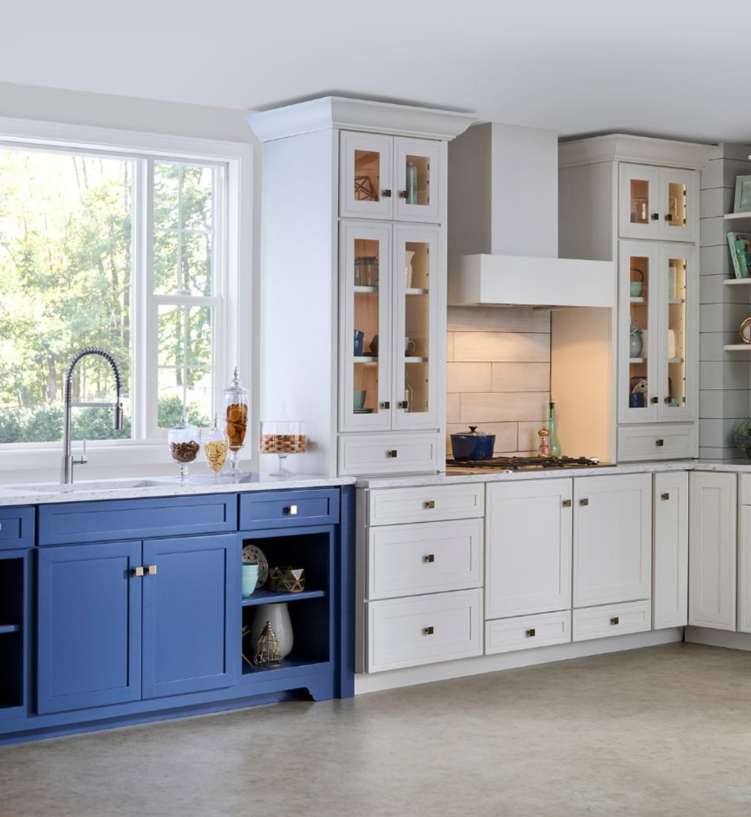 Modern kitchen with two-tone cabinetry and sleek hardware.